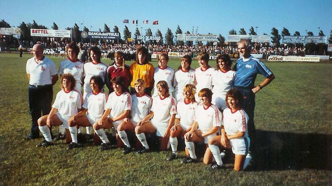 Michelle Akers, Emily Pickering combined for first goals in U.S. Women’s National Team history; Denise Bender first to wear captain’s armband
