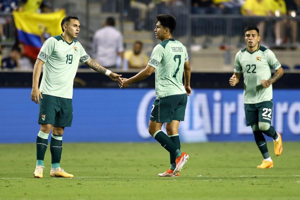 three bolivian players on the field