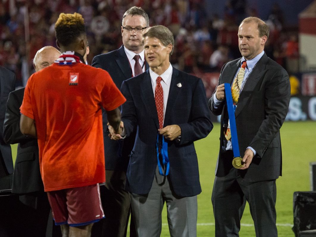 Clark (center), Dan (right) handing out medals following FC Dallas’ 2016 U.S. Open Cup Final victory | Photo courtesy Hunt family
