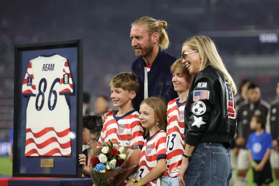 Tim Ream poses with his family as he is honored for 86 caps with USMNT prior to the international match between U.S. and Chile at Energizer Park (Photo by Jamie Squire/Getty Images)