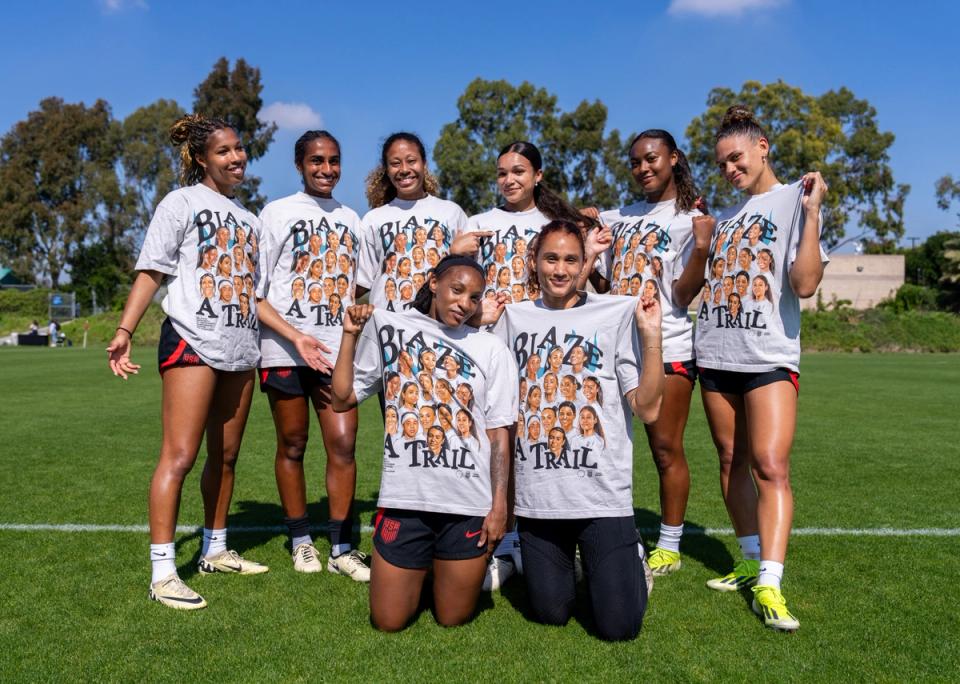 Margaret Purce, Naomi Girma, Casey Krueger, Sophia Smith, Jaedyn Shaw, Trinity Rodman, Crystal Dunn and Lynn Williams of the United States pose with tshirts celebrating Black History Month after USWNT Training at Dignity Health Sports Park on February 22, 2024 in Carson, California.