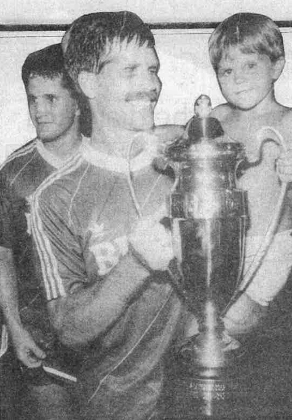 Greg Makowksi and his son, Jeffrey, hold the U.S. Open Cup trophy | Image courtesy Jeff Robben/Joe Angeles