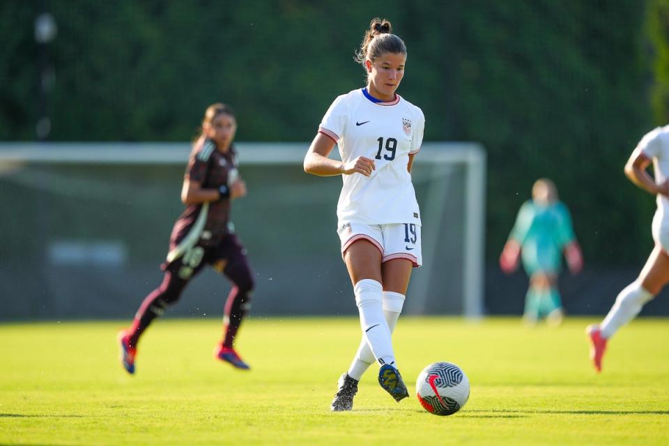 USA Number 19 Pietra Tordin dribbles the ball down field during a match against Mexico