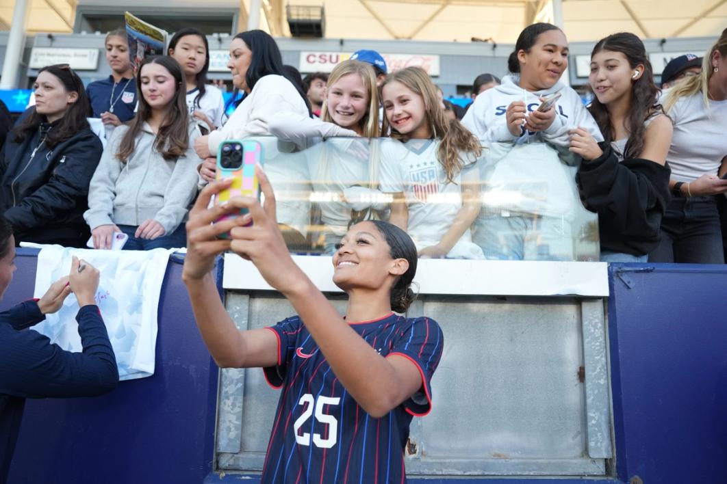 Reilyn Turner meets fans after the match