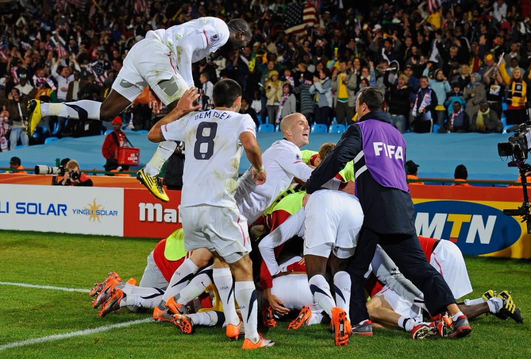 The USMNT celebrates Landon Donovan's winning goal that sends the USA through to the second round during the 2010 FIFA World Cup South Africa Group C match between USA and Algeria at the Loftus Versfeld Stadium on June 23, 2010 in Tshwane/Pretoria, South Africa (Photo by Kevork Djansezian/Getty Images)