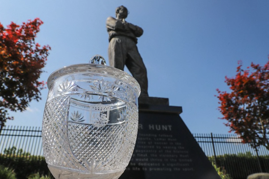 The old U.S. Open Cup trophy perched beneath a statue of Lamar Hunt at Historic Crew Stadium | Image courtesy Columbus Crew