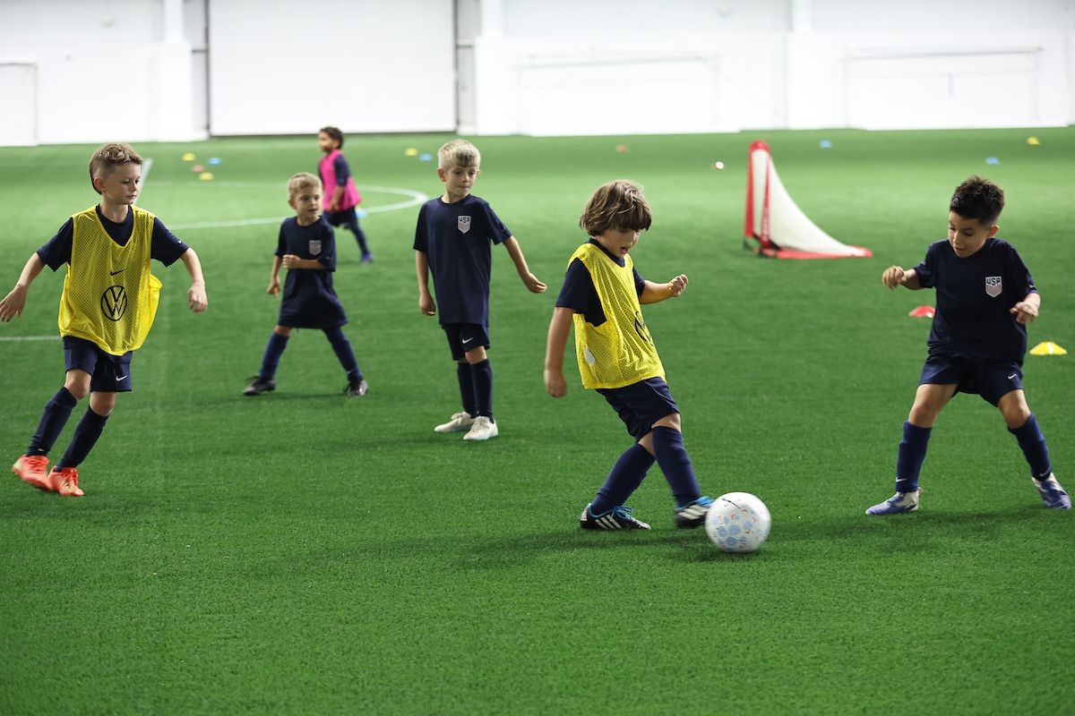 Young players competing in a small-sided soccer game during training